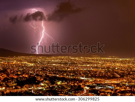 Lightening strike over the city of Queretaro Mexico. In this picture you can see can clearly Los Arcos a historic landmark of the historic town. 