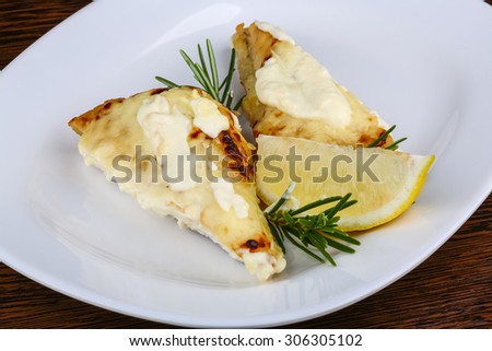 Baked perch fillet with rosemary and lemon