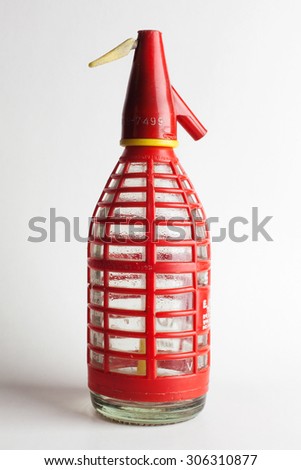 Red plastic water bottle protection case in a white background
