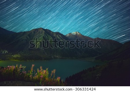 Big Almaty lake at night. Perseid shower