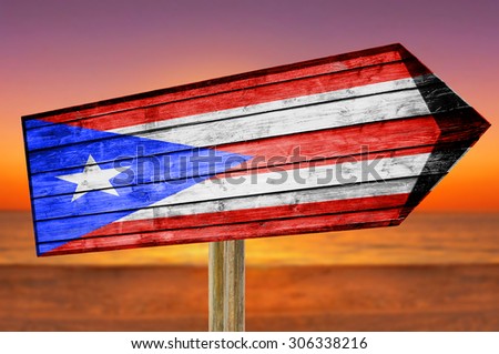 Puerto Rico Flag wooden sign with beach background