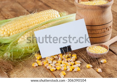 Photo of business cards. Template for branding identity. For graphic designers presentations and portfolios. With corn on wooden background. Subject agronomist, agriculture