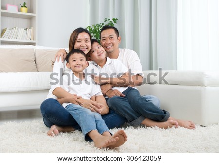 Indoor portrait of asian mixed race family Royalty-Free Stock Photo #306423059