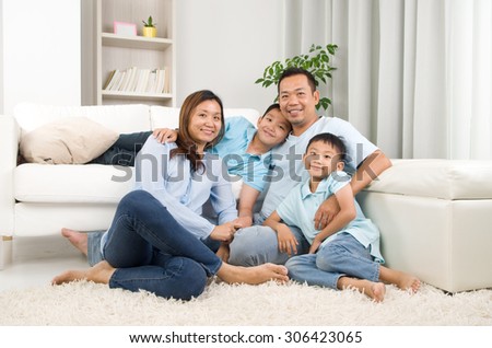  Indoor portrait of asian family Royalty-Free Stock Photo #306423065