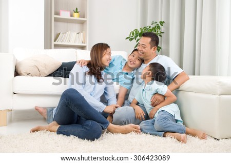  Indoor portrait of asian family Royalty-Free Stock Photo #306423089