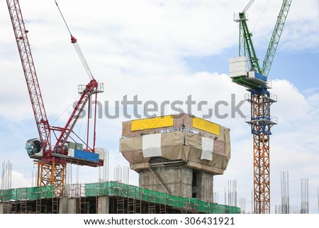 Crane working building in city on sky.