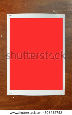 Red poster frame on wood wall