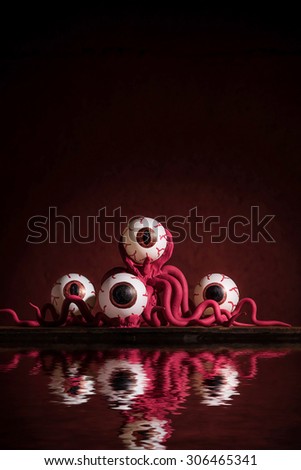Octopus Monster on dark red background on river side