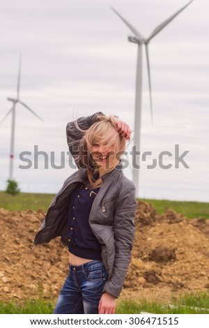 girl on nature near windmil