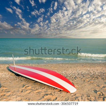 Surfboard on the beach. Seascape.