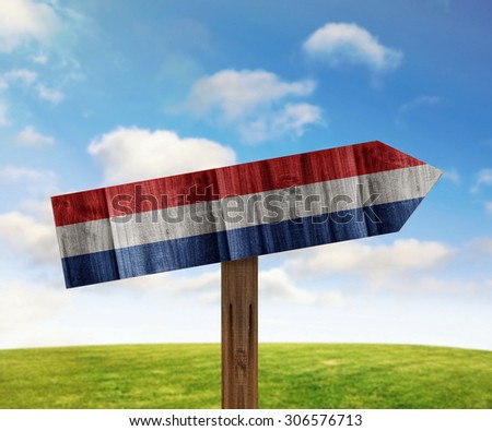 Netherlands wooden direction sign on nature background