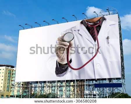 doctor holding stethoscope on billboard with white space 