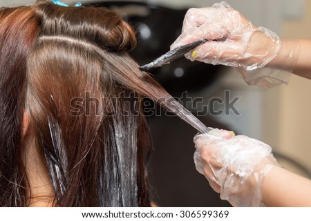 hair coloring in a beauty salon Royalty-Free Stock Photo #306599369