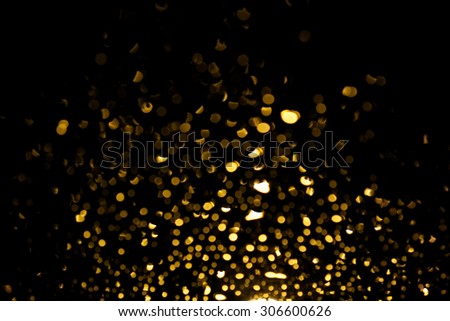 Bokeh gold colour in night time abstract background.