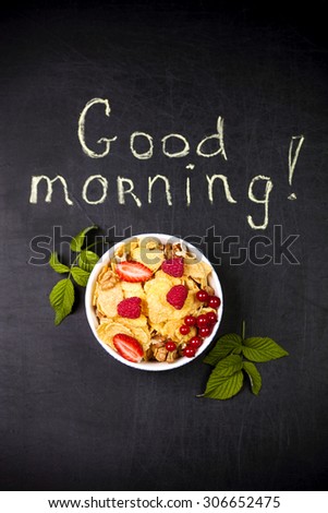 Healthy breakfast on a black background and a "good morning" text
