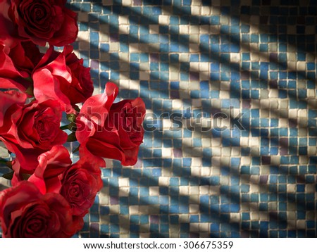 red rose on tiled wall decorative concept background
