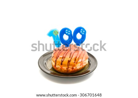 donut with one hundred years birthday candle on white