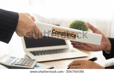 personnel send files manual compliance to manager in office.  Royalty-Free Stock Photo #306766586
