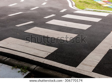 Asphalt road with crosswalk