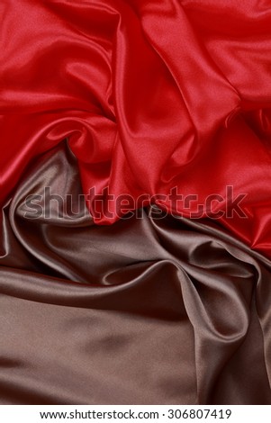 Brown and red silk texture satin velvet material or elegant wallpaper design curve folds wavy background