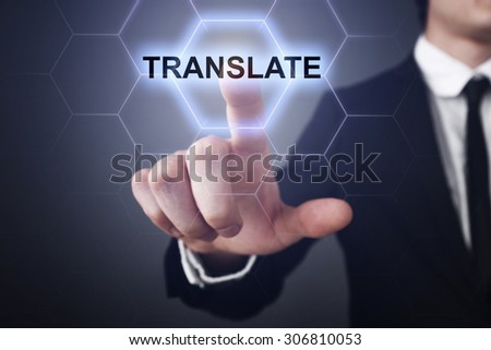Businessman pressing touch screen interface and select icon "translate". Business concept. Internet concept.