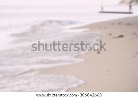 Blurred photo of sunny day on the beach.