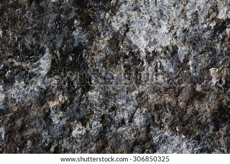 bricks made of gray granite ashlar in background texture