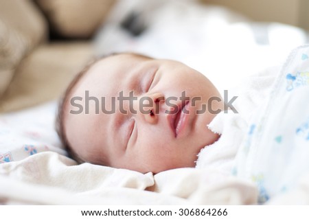 newborn baby (2 weeks) sleeping Royalty-Free Stock Photo #306864266