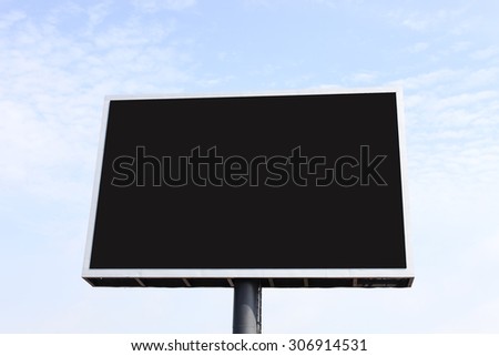 large outdoor advertisement beside highway