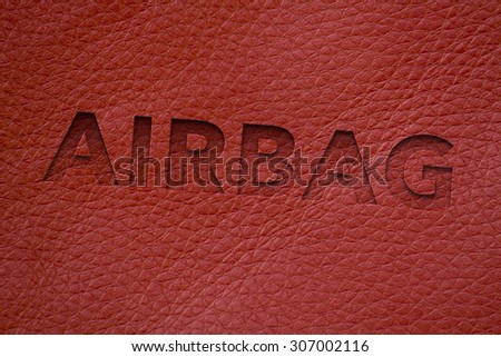 The word airbag written on car interior leather for safety image