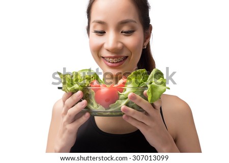 Asia woman enjoying salad isolated on white background