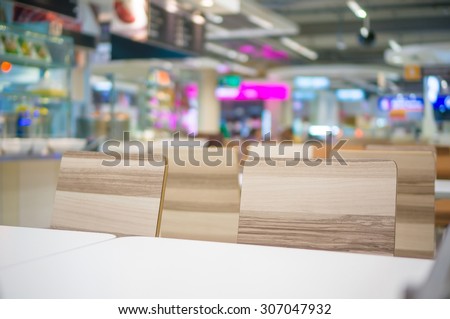 Tables and chairs on food court in huge mall