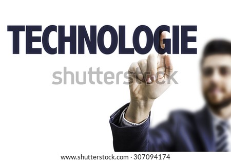 Business man pointing the text: Technology (in French)