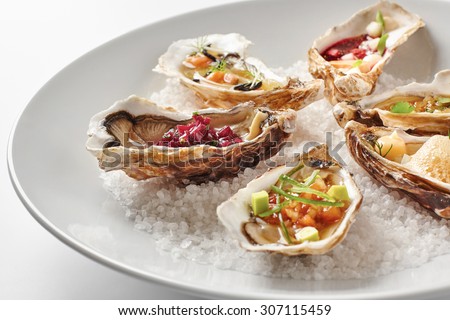 Fine dinning oysters plate in modern style Royalty-Free Stock Photo #307115459