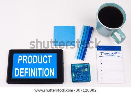 Business Term / Business Phrase on Tablet PC - Blues, cup of coffee, Pens, paper clips Calculator with a blue note pad on White - White Word(s) on blue - Product Definition