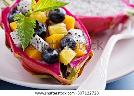 Tropical fruit salad served inside a dragon fruit