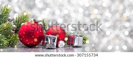 Gift boxes,ball and fir branch on abstract background