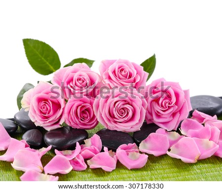 Set of pink roses with black stones on green mat