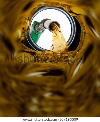 Refilling fuel view from inside of gas tank of a car Royalty-Free Stock Photo #307193009