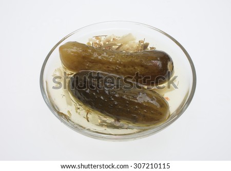 pickled cucumber or sour gherkin over white