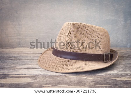 still life with hat on wooden background
