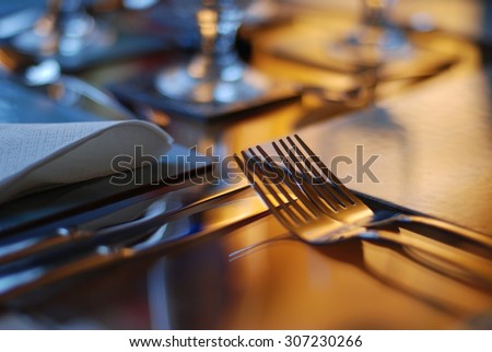 Table set for fine dining with cutlery and glassware Royalty-Free Stock Photo #307230266