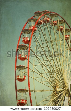 Vintage retro red ferris wheel.  Cross processed to look like and instant picture with texture. instagram style