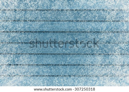 Frozen wooden boards in snow, top view