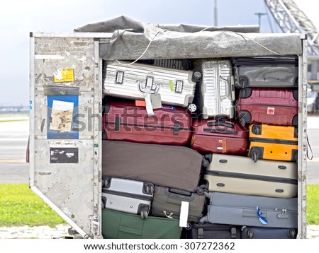  Baggage fully loaded in cargo container Royalty-Free Stock Photo #307272362
