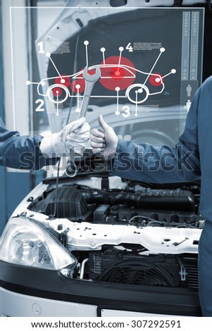 Car interface against team of mechanics working together