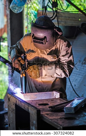 Industrial worker welding. Electric welding work.