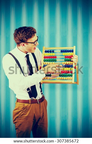 Geeky businessman using an abacus against blue background