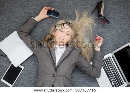 Overworked business woman Royalty-Free Stock Photo #307389716
