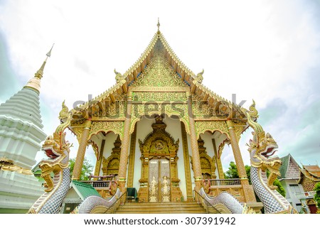 The gold color temple in the cloudy day (blue cloudy sky style. In Thailand , temple is a public area and can take photo but just respect rules such as be quiet , take picture respectly etc